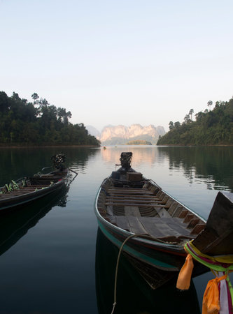 Thai wooden boat with diesel engine parking for some passenger
