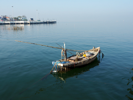 Local Thai fisherman boat afterwor work in moring parking near beach in seaの写真素材
