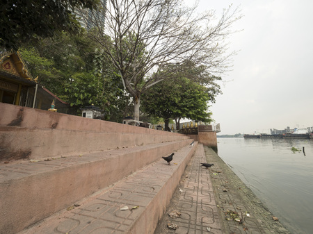 side of Chaophaya river in Bangkok on cloundy dayの写真素材