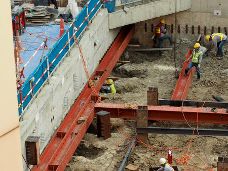 Team of worker in a construction area work with steel  structure