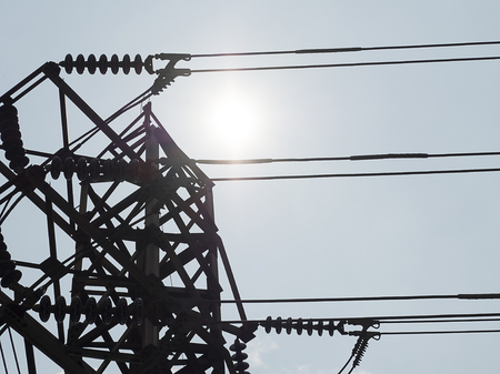 high voltage electric tower on afetrnoon sky with sunshineの写真素材