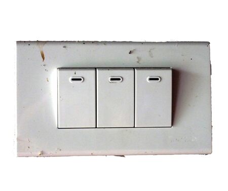 Three old electric rectangle switch on old wood wall with some dustの写真素材