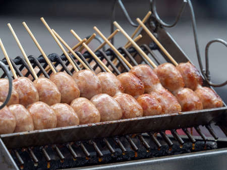 Sai krok Isan on grill of charcoal stove for street foodの写真素材