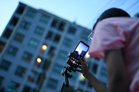 Asia girl try to use camera mode in smartphone