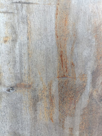 Textured surface resembling weathered stone or concrete with natural color variations, including...