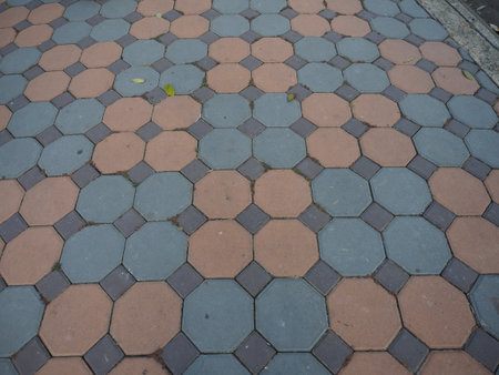 Pavement pattern octagon tile geometric design outdoor walkway stone texture urban floor sidewalk symmetry calm moodの写真素材