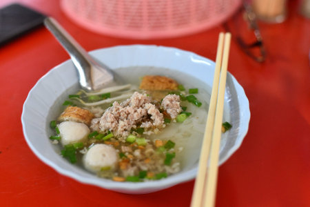 Asian soup rice porridge minced pork fish ball green onion breakfast hot soup street food comforting...