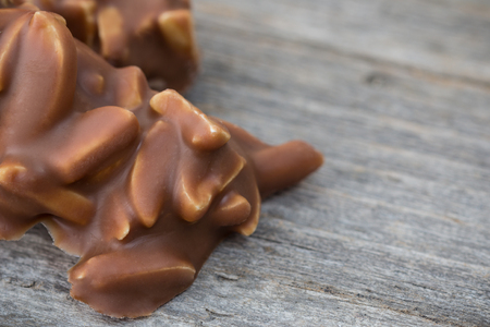 Special chocolate pieces on wooden backgroundの写真素材