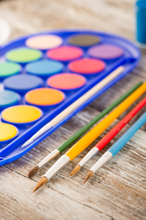 special painting tools on wooden background, education tools for schoolsの写真素材