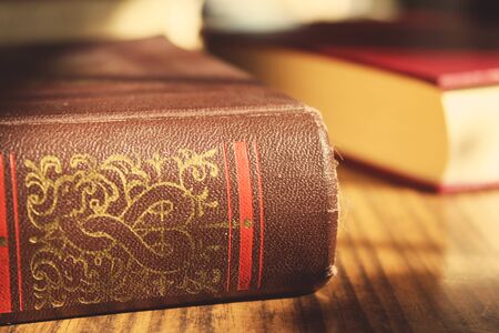 big old book in the tableの写真素材