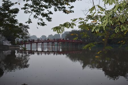 Closeup of Lake Hoan Kiem at Hanoi with beautiful red Huc Bridge, Vietnam, Asiaの写真素材