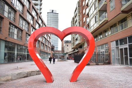 Famous Distillery District with a big heart sculpture in Toronto, Canadaのeditorial素材