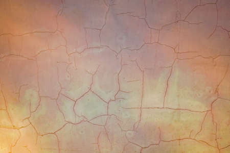 Painted concrete wall with cracks background. Old floor texture. Aged cracked paint on cement stone.の写真素材