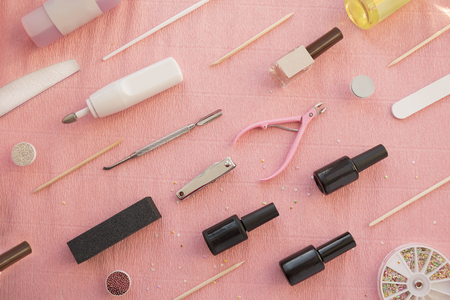 Pink background with set of equipment for gel nail manicure or pedicure.の写真素材
