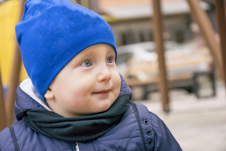 Cheerful little kid in stylish clothesの写真素材