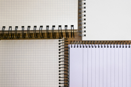 Open notepads set isolated on wooden backdropの写真素材