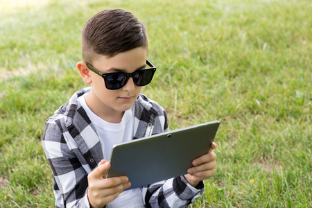 Young boy with modern deviceの写真素材
