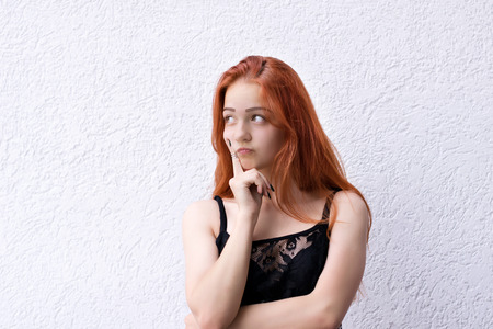 Thoughtful girl looking awayの写真素材