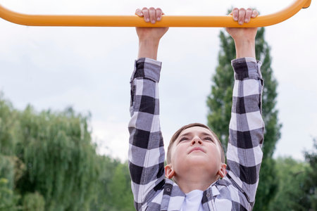 Teenager doing pull ups