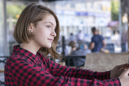 Carefree elegant lady in street cafeの写真素材