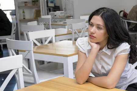 Dreamy young woman posing insideの写真素材