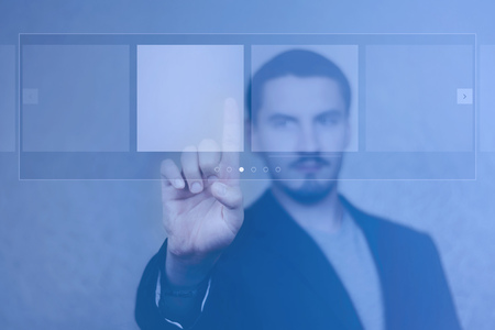 Man with mustache pressing buttonの写真素材