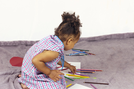 Beautiful child enjoying paintingの写真素材