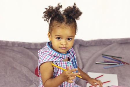 Beautiful child enjoying paintingの写真素材