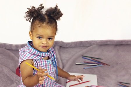 Beautiful child enjoying paintingの写真素材