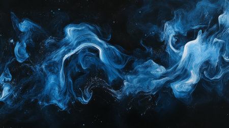 Abstract blue smoke swirling against a black background, mysterious and etherealの素材