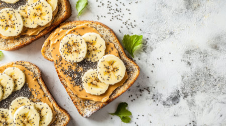 Toast topped with creamy peanut butter and banana slices, sprinkled with chia seeds, creating a nutritious and delicious breakfast optionの素材