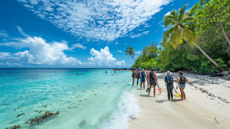 A group of tourists excitedly gearing up for a snorkeling excursion on a pristine tropical beachの素材