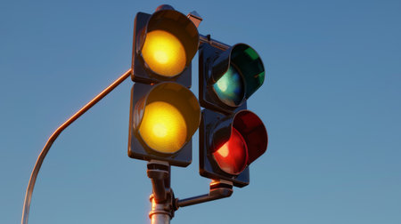 A traffic light pole with signals for left turn, straight, and right turn lanes.の素材