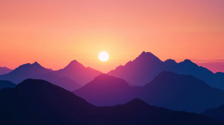 Close-up of a mountain range silhouetted against a vibrant sunset, with the sun dipping behind the peaksの素材