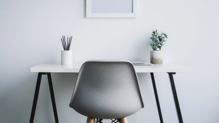 Detailed shot of a minimalist home office with a tidy desk, minimalistic decor, and a modern chairの素材