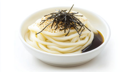 A tempting bowl of udon noodles topped with seaweed and sesame seeds, perfect for showcasing Japanese cuisine and healthy meals in photography.の素材