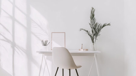 A serene minimalist workspace featuring a sleek desk, a stylish chair, and a decorative plant. Natural light casts soft shadows, creating a calm atmosphere.の素材