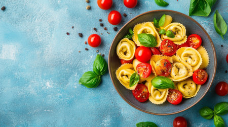 A vibrant pasta dish featuring cherry tomatoes and fresh basil, perfect for a summer meal. Ideal for cooking enthusiasts and culinary presentations.の素材