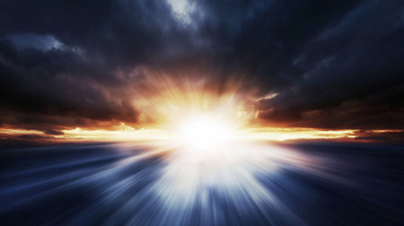 A stunning view of the rising sun casting warm rays over a calm ocean, with dramatic clouds creating a beautiful scene brimming with tranquility and peace.の素材