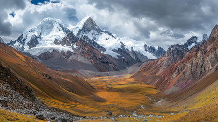 Explore a stunning alpine landscape showcasing towering snow-capped mountains, vibrant autumn colors in the valleys, and a dramatic sky filled with clouds. Perfect for nature lovers.の素材