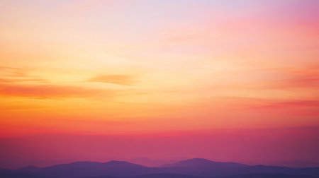 A stunning sunset casts gentle color gradients over distant mountains, creating a peaceful and serene atmosphere. Ideal for nature lovers and adventurers.の素材