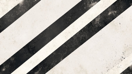 A striking abstract background featuring bold black and white diagonal stripes with a textured grunge effect. Ideal for various creative projects.の素材