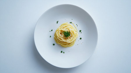 A minimalistic composition of a single serving of spaghetti tossed in garlic and olive oil, garnished with fresh parsley on a plain white plate, highlighting its simplicityの素材