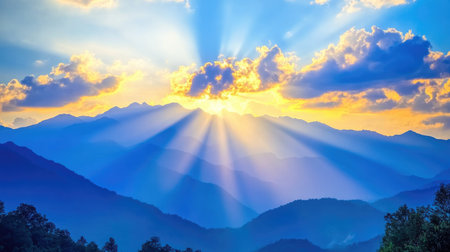 A dramatic shot of a mountain range at sunrise, with rays of light breaking through clouds and illuminating the rugged terrain, creating a sense of awe and wonderの素材