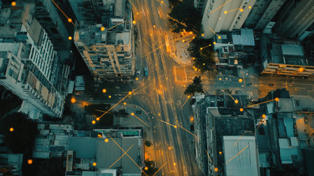 An aerial view of a smart city, with lines and dots representing a digital network overlaying the buildings, roads, and devices, illustrating real-time connectivityの素材