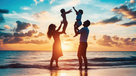 A family silhouette at the beach, with parents holding their children up in the air, capturing the carefree spirit of a day by the seaの素材