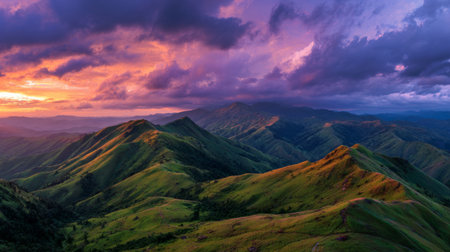 Experience the stunning beauty of a majestic mountain landscape at sunset, where vibrant colors paint the sky and create a serene atmosphere in nature's embrace.の素材