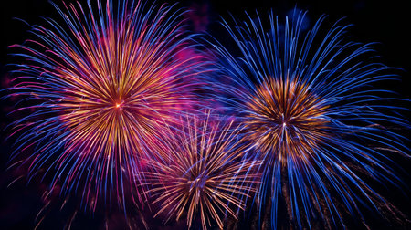 Experience the awe of dynamic fireworks bursting in vivid colors against a dark sky, perfect for celebrations and events, evoking joy and excitement.の素材
