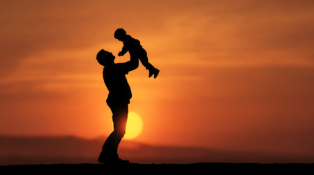 A touching silhouette of a father lifting his child against a stunning sunset, symbolizing love, joy, and the beauty of family moments in nature.の素材