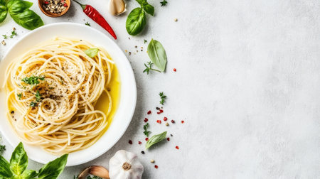 A beautiful dish of fresh spaghetti drizzled with olive oil, surrounded by vibrant herbs and garlic. Perfect for culinary inspiration and meal prep.の素材